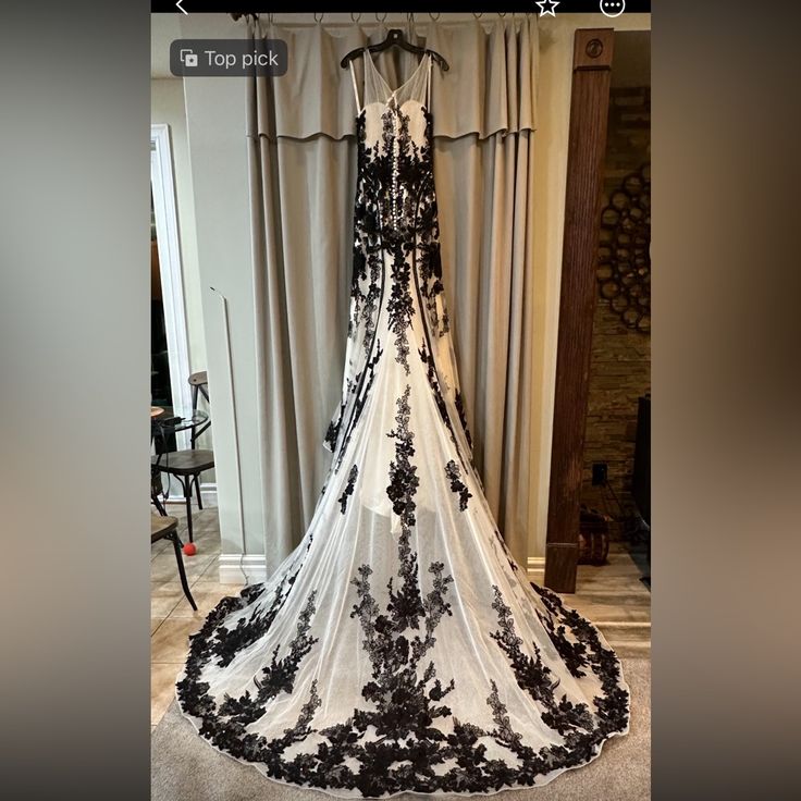 a black and white wedding dress is on display