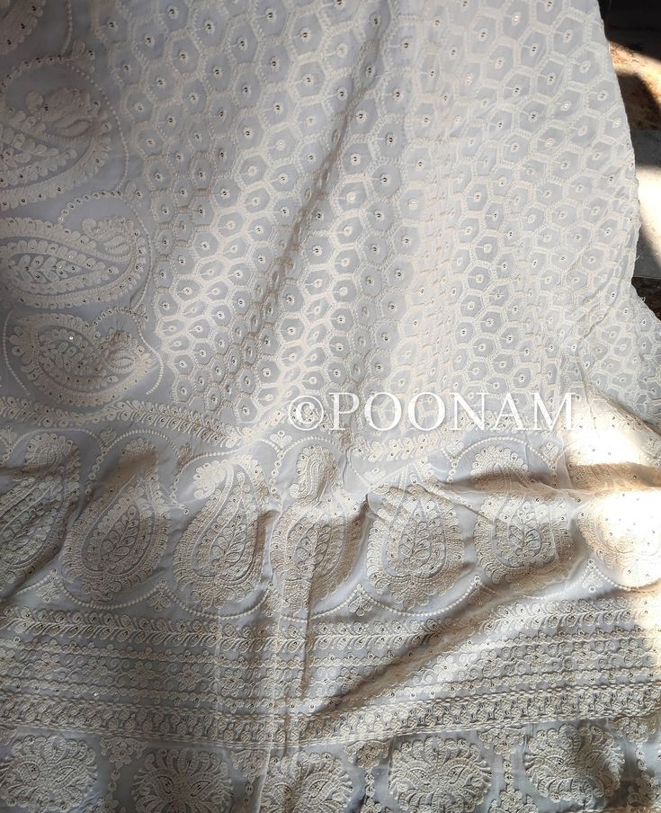 Pure georgette saree with very heavy and intricate chikankari shadow & murri embroidery, embellished with scalloped work allover. Pallu and body fully embroidered. The color of the actual product may slightly differ from the pictures. It comes with an unstitched blouse, if you want the blouse stitched please contact me, the blouse can be stitched with an additional cost. Hand embroidered items may have some loose threads. Fabric: Pure Georgette Work: Chikankari Wash: Hand Wash/Dry Clean Product color may slightly vary due to photographic lighting sources or your monitor settings. NOTE: All our items are handmade and specially customized for our beautiful customers. Please expect minor variations in the actual product as compared to the image displayed. Product color may slightly vary due t Cream Georgette Saree With Intricate Embroidery, Off White Georgette Saree With Intricate Embroidery, Cream Georgette Traditional Wear For Wedding, Traditional White Lehenga With Lace Work, Off White Chikankari Embroidered Saree For Wedding, Semi-stitched Resham Embroidery Sharara For Marriage, Cream Saree With Chikankari Embroidery, Resham Embroidery Semi-stitched Sharara For Wedding, Off White Chikankari Embroidery Saree Fabric