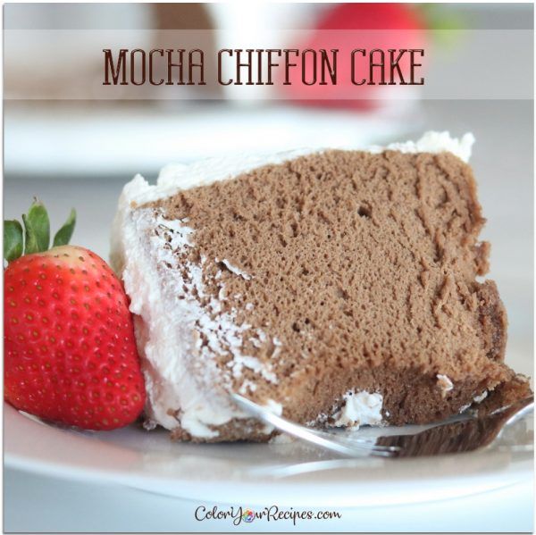 a piece of mocha chiffon cake on a white plate with a strawberry