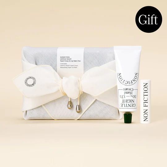 the gift set includes an eye cream, lip balm and hand lotion tube