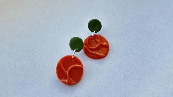 These super fun Orange and Sage green earrings will spice up your outfit in such a fun way! These handmade earrings are Nickle free! Green Handmade Fun Earrings, Fun Green Earrings For Gifts, Green Fun Earrings For Gifts, Fun Green Earrings For Gifting, Green Fun Earrings For Gift, Fun Green Nickel-free Earrings, Fun Orange Drop Earrings, Handmade Green Fun Jewelry, Handmade Fun Green Jewelry