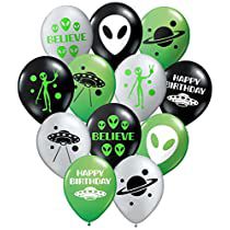 an assortment of alien balloons with the words believe and happy birthday written on them in green