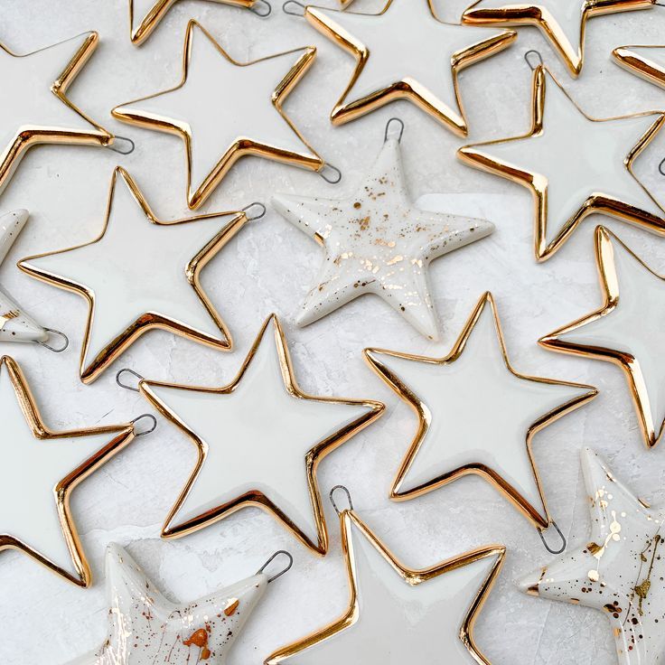 A collection of handmade star ornaments with gold Ceramics Ornaments, Clay Christmas Decorations, Ceramic Christmas Decorations, Christmas Clay, Polymer Clay Christmas, Keramik Design, Xmas Diy, Pottery Crafts, Clay Ornaments