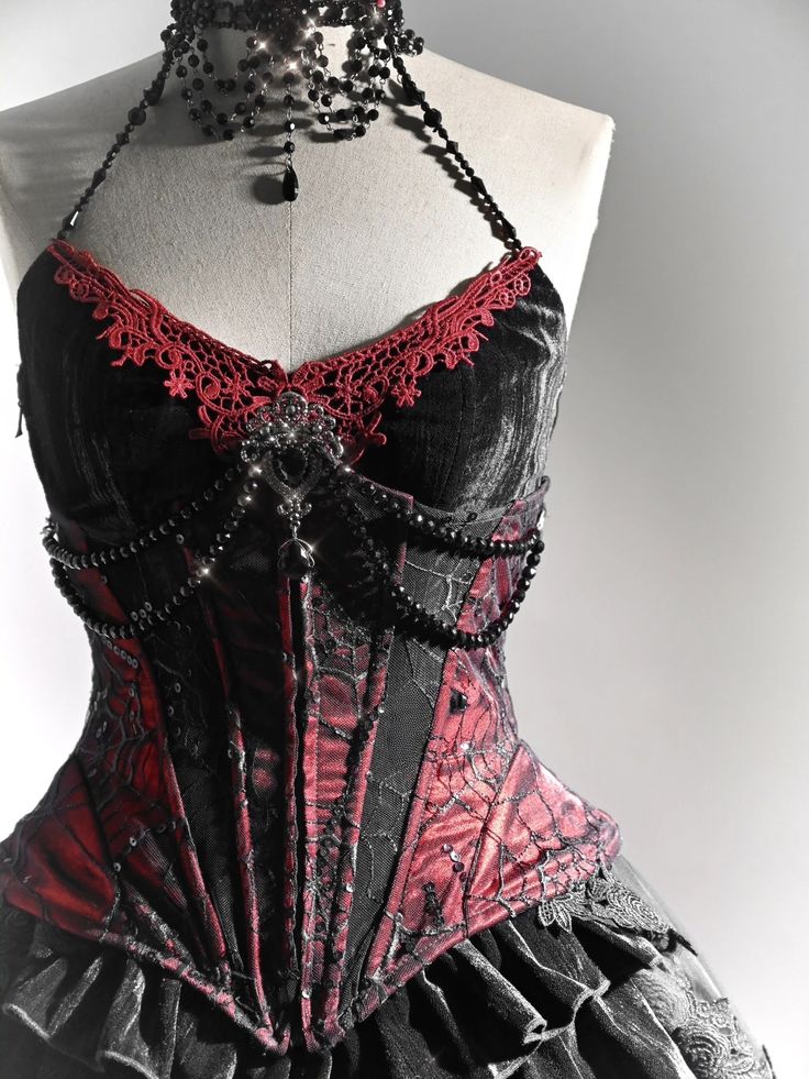 Exquisite Handmade Beaded Halter Neck Corset Top with Red Lace Applique – Featuring a V-Shaped Neckline and Slim Fit for a Captivating Vampire Look.   	 		 			Size 			S 			M 			L 			XL 		 		 			Bust 			83 			87 			91 			95 		 		 			Waist 			66 			70 			74 			78 		 		 			Hem Circumference 			74 			78 			82 			86 Dnd Clothes, Spiderweb Lace, Modern Mythology, Velvet Corset Top, Red Vampire, Gothic Spider, Vampire Fashion, Victorian Vampire, Vampire Clothes