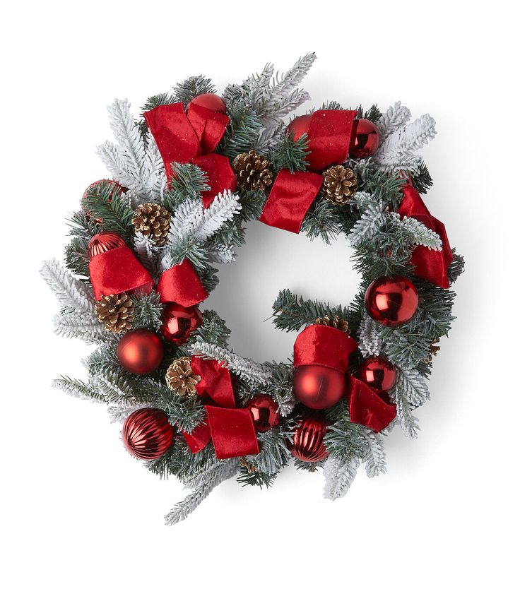 a christmas wreath with red and silver ornaments