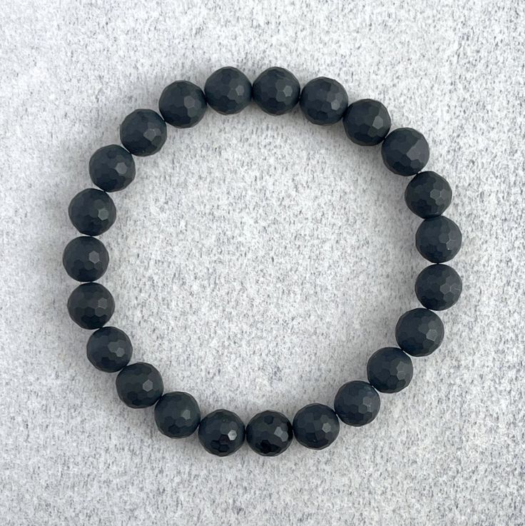 ~ 6mm or 8mm Faceted Matte Onyx beads ~ Stretchy cord; simply slide bracelet on and off wrist ~ Comes packaged in a re-usable micro fibre pouch To ensure the perfect fit, please use the bracelet sizing instructions found in the photo gallery. Minimalist Stretch Bracelet With Round Beads For Everyday, Minimalist Stretch Bracelet With Round Beads, Minimalist Everyday Stretch Bracelet With Round Beads, Adjustable Minimalist Wristband With Round Beads, Minimalist Adjustable Wristband With Round Beads, Hand-strung Adjustable Onyx Stretch Bracelet, Classic Black Beaded Bracelets For Everyday, Hypoallergenic Round Beaded Bracelets For Everyday, Everyday Hypoallergenic Round Beaded Bracelets