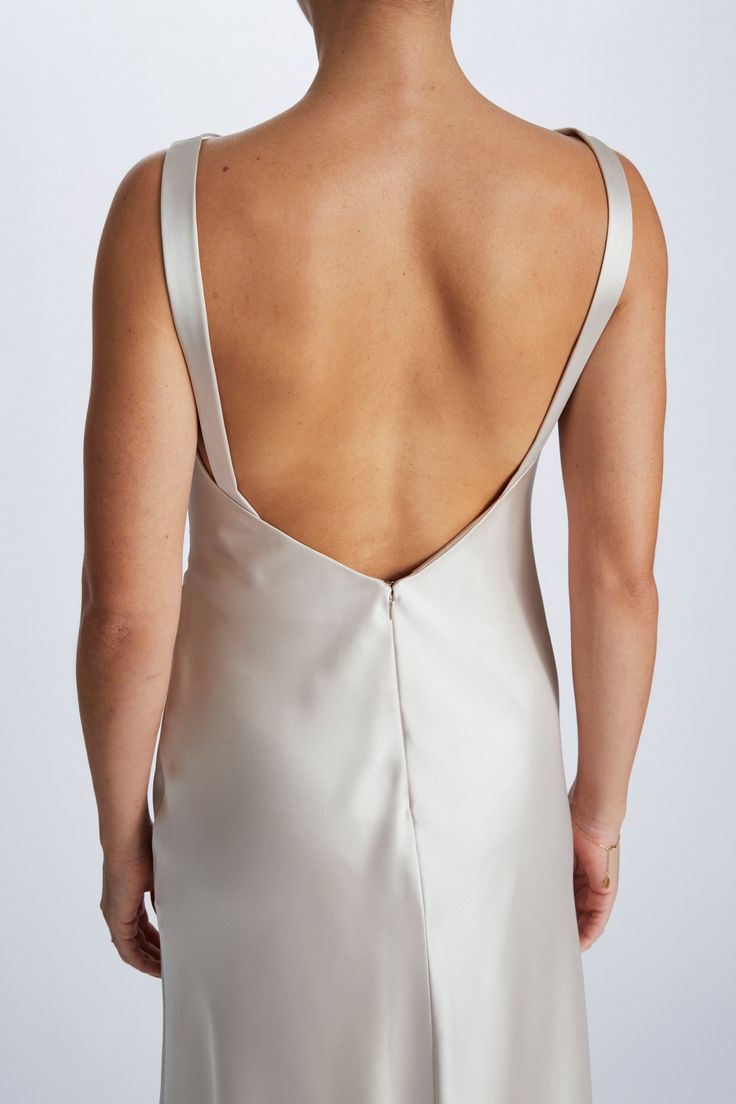 the back of a woman in a white dress