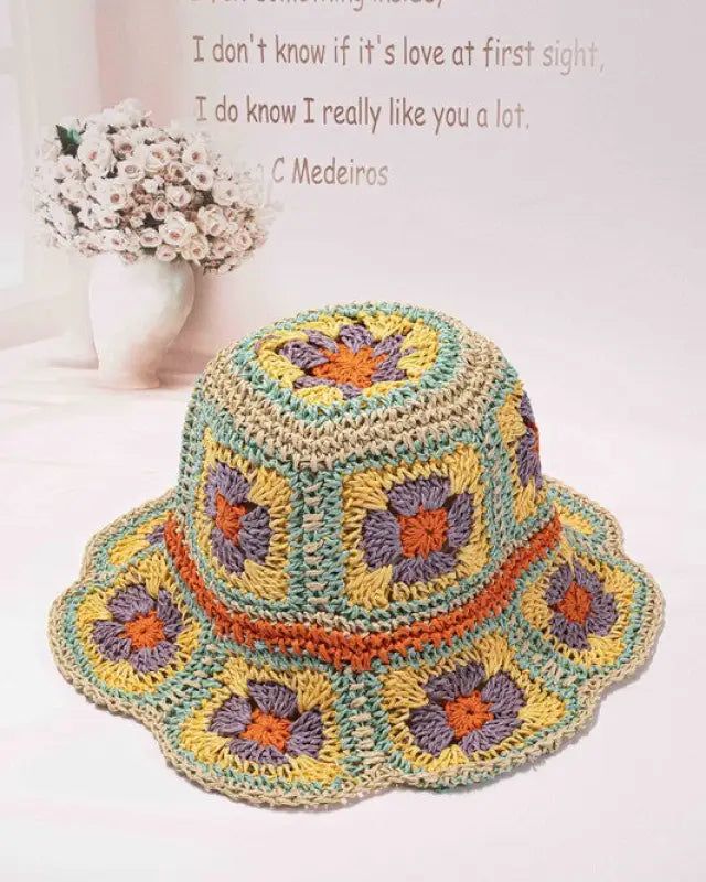 This artfully crafted bucket hat has a definite, vintage wow factor. created entirely of hand-crocheted paper. It has flower patterns all over the hat. Made of 100% straw. Size adjuster inside. Can be folded very small to fit in your purse. Handmade Straw Bucket Hat For Spring, Crochet Straw Bucket Hat For Spring, Spring Crochet Straw Bucket Hat, Yellow Bohemian Crochet Hat For Spring, Multicolor Woven Crochet Hat For Spring, Yellow Hand Knitted Beach Hat, Bohemian Bucket Hat For Garden Party, Retro Brimmed Bucket Hat For Beach, Handmade Flower Hats For Summer