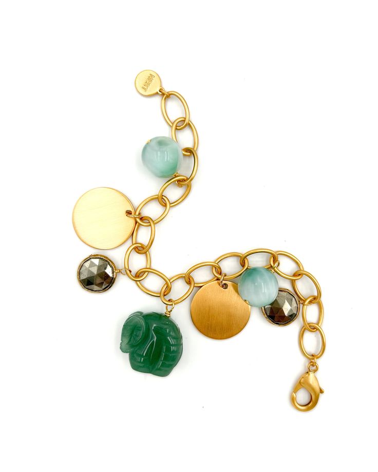 22-karat gold-plated brass Moonstone, jade, and pyrite charms Lobster clasp closure Handcrafted in our TX studio Bohemian Gold Bracelet With Moon Charm, Gold Amazonite Jewelry With Natural Stones, Gold Bracelets With Aventurine Natural Stones, Gold Bracelets With Natural Aventurine Stones, Gold Jade Bracelets With Natural Stones, Gold Amazonite Gemstone Beads Jewelry, Gold Amazonite Bracelet Jewelry, Gold Amazonite Jewelry With Gemstone Beads, Amazonite Bracelet Jewelry In Gold