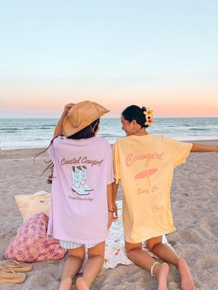 Coastal Cowgirl shirt, beach shirt, sunset shirt, trendy oversized shirt, summer shirt, summer beach shirt, gift for her, comfort colors tee  Hi, welcome to CCAPPARELTX! If you are looking for trendy lifestyle apparel for your best moments in life, then you have come to the right place. You can find comfortable and casual clothing that you can CUSTOMIZE, for you and your loved ones. We hope you enjoy your time at our shop, the processing time is currently 1-5 days. If you would like to rush your Beach Season Short Sleeve T-shirt For Day Out, Pink Summer T-shirt For Day Out, Beachy Camp Shirt For Summer Vacation, Summer Cotton T-shirt For Beach Party, Summer Cotton Camp Shirt For Beach Season, Cotton Camp Shirt For Beach Season, Summer Beach Camp Shirt With Short Sleeves, Beachy Short Sleeve Camp Shirt For Summer, Summer Beachy Short Sleeve Camp Shirt