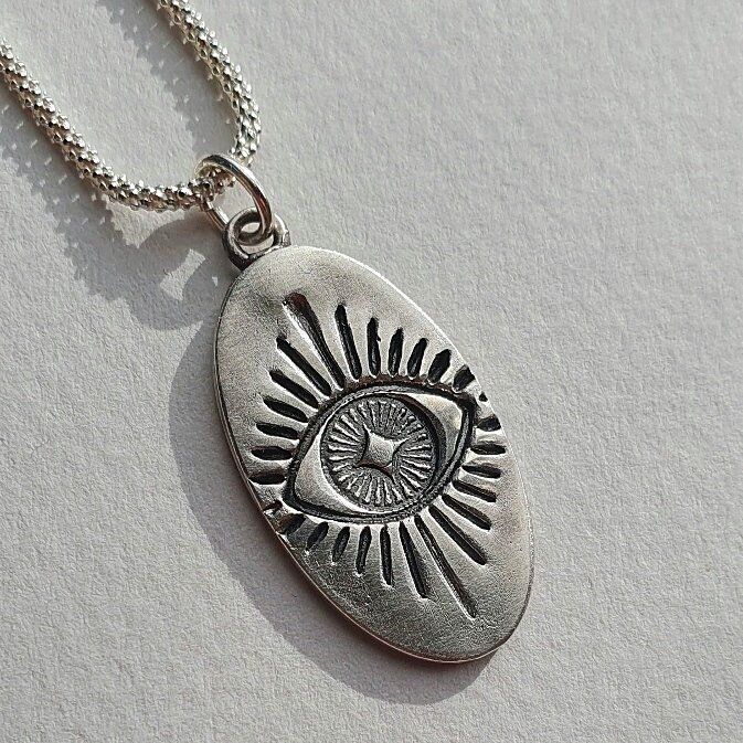 "This silver necklace features the mythical Evil Eye pendant and a sterling silver chain. It can make a great gift for a loved one or be a protection gift for yourself. The Evil Eye Symbol is known to guard against misfortune and negative energy. It brings good luck and protects you from envy and bad thoughts. Layer up this pendant with other designs or chains from EgoElements to create unique looks💫 Materials 999 fine silver pendant 925 sterling silver chain (if ordered with a chain) Size (app Evil Eye Jewelry Necklace, Coffee Necklace, Summer Pendant, Necklace Evil Eye, Eye Symbol, Bad Thoughts, Protection Amulet, Amulet Necklace, Charm Necklace Silver