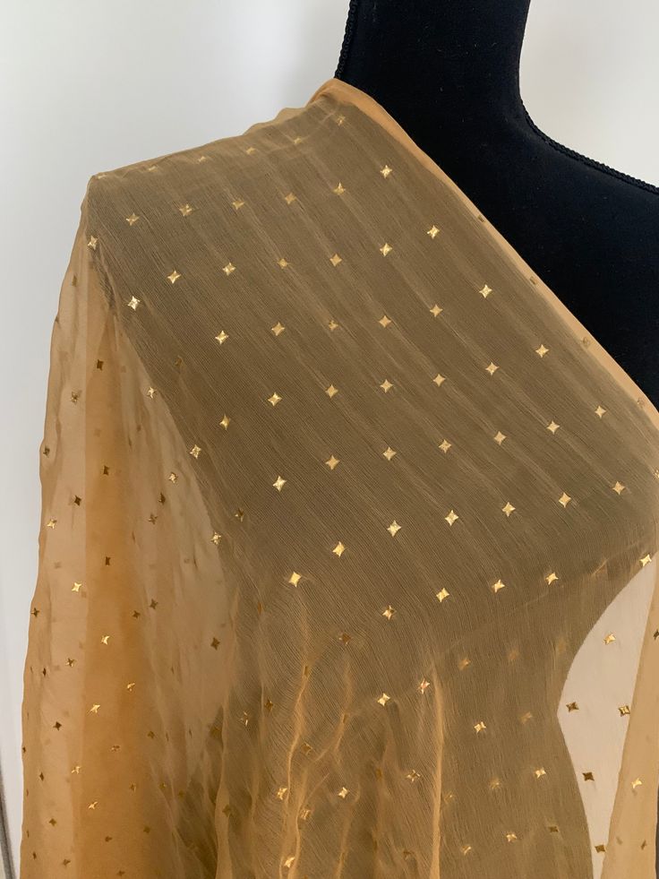 Beautiful and bright gold dupatta with stars to match several Indian Kurtas, kurta sets. Makes a great gift too. You could easily style this as a scarf with your winter coat. Add a little sparkle and color with this pretty one. Elegant Winter Festive Dupatta, Gold Blouse Piece With Gota Work For Diwali, Gold Anarkali Blouse With Dupatta, Gold Anarkali Blouse Piece With Dupatta, Unstitched Gold Blouse Piece With Gota Work, Gold Bollywood Blouse Piece, Gold Bollywood Blouse Piece With Dupatta, Unstitched Gold Blouse Piece With Mirror Work, Festive Gold Blouse With Gota Work