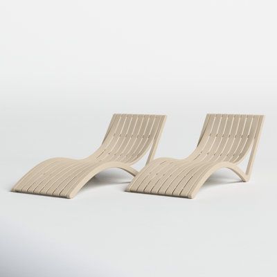 two lounge chairs sitting next to each other