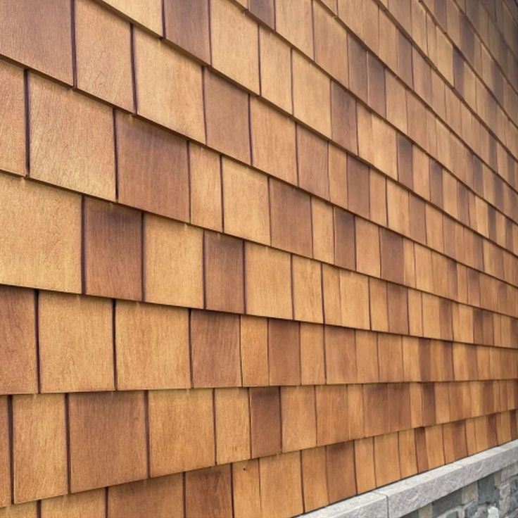 the side of a house with wood siding