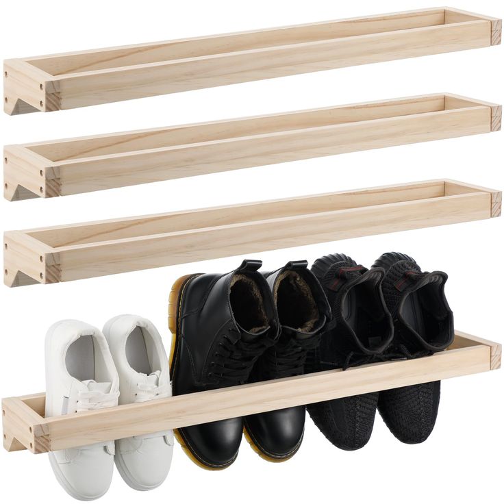 three pairs of shoes are hanging on the wall and two shelves hold them in place