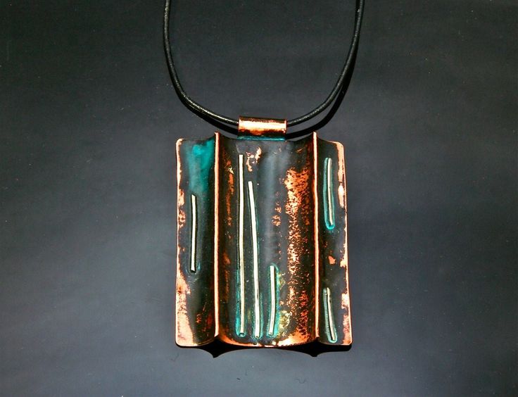 Copper pendant with sterling silver and oxidized to give an organic, antique look. We also treat the copper with a protective finish front and back. The necklace comes with an adjustable leather band.   Measurements:  3.4 x 4.6cm // 1 3/8" x 1 3/4" measurements can vary slightly   The pendant is available with blue/green patina or with the natural colour of copper. When we apply the blue/green patinas we let nature takes its course. The shade can range from green to turquoise to blue to dark blu Adjustable Bronze Patina Necklaces, Artisan Necklace With Adjustable Patina, Adjustable Electroformed Bronze Necklace, Brown Patina Necklace For Gift, Brown Patina Jewelry For Gifts, Brown Patina Jewelry Gift, Rectangular Patina Jewelry As Gift, Artisan Rust-colored Jewelry With Patina, Bronze Copper Necklace With Patina