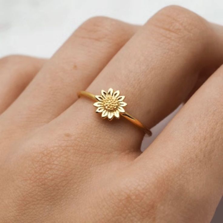 Bring Sunshine To Your Life Everyday! Add This Exquisite Floral Ring To Whatever You Are Wearing. It Features A Beautiful Sunflower Plated In 18k Gold. Simple And Elegant. Sunflowers Symbolize Happiness, Optimism, Honesty, Longevity, Peace, Admiration, And Devotion. The Sunflower Possibly Surpasses All Others In Terms Of Its Universal Power To Bring Joy To People. With A Round Face And Bright Yellow Petals Resembling Rays Of Sunshine, The Sunflower Has Important Cultural And Spiritual Significan Gold Flower Rings For Spring, Gold Floral Rings For Spring, Spring Flower-shaped Gold Rings, Yellow Flower Ring For Anniversary, Sunflower Design Rings As Gifts, Yellow Flower Ring For Wedding, Sunflower Design Flower Ring For Gift, Sunflower Ring, Ring Der O