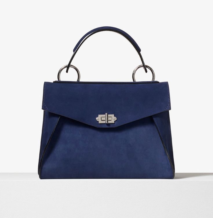 PROENZA SCHOULER Suede Small Hava Top Handle Bag Indigo Length: 6.5" Width: 3.5" Height: 7" Handle drop:4.5" Strap length: 34.5" / 19" drop. This chic bag is crafted of soft suede leather in dark blue. The shoulder bag features a suede and leather top handle with a facing V shaped flap pocket, a rear zippered pocket and a polished silver turn lock closure. The flap opens to a black leather interior with a front and patch pocket. This is a splendid satchel for everyday use, from Proenza Schouler. Chic Bags, Handle Bag, Proenza Schouler, Soft Suede, Leather Interior, V Shape, Leather Top, Flap Pocket, Patch Pocket