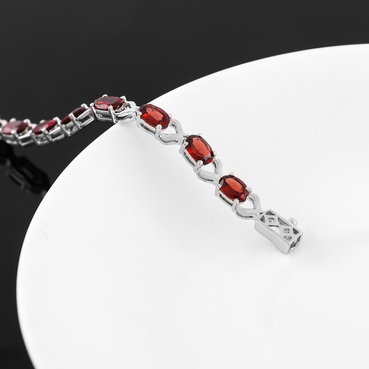 Introducing our Red Garnet Bracelet, a unique piece of jewelry that combines style and elegance. This handmade bracelet, crafted with 925 Sterling Silver, is more than just an accessory. It's a statement of sophistication, a testament to beauty, and a perfect gift for the special person in your life. Key Features: Red Garnet Gemstone: The bracelet features a captivating red garnet gemstone, known for its deep red color and its ability to inspire love and devotion. Birthstone Bracelet: Red Garnet Elegant Garnet Bracelets For Formal Occasions, Elegant Natural Ruby Gemstones, Garnet Bangle Jewelry Gift, Garnet Bangle Jewelry As Gift, Fine Jewelry Bracelets With Stones As Gift, Garnet Gemstone Bracelet Jewelry, Fine Jewelry Bracelets With Stones For Gift, Elegant Jewelry With Garnet Natural Stones, Elegant Garnet Gemstone Bracelets