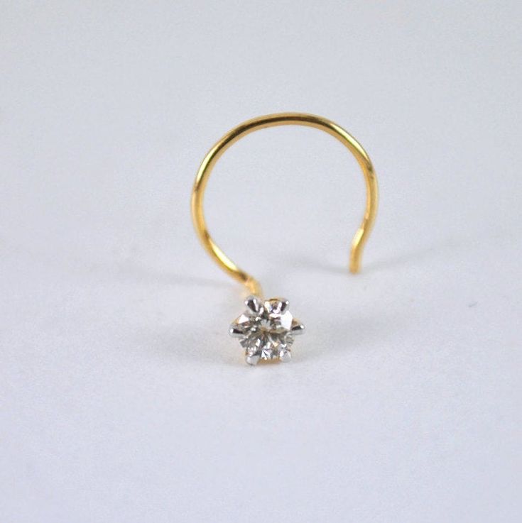 "Dainty genuine diamond nose pin, hand crafted in 14k solid gold, these C & L wire studs are perfect for any occasion. An intrinsic part of your everyday, they can be worn in multiple types of piercings. * Diamond Wt : 0.01ct to 0.10ct (for bigger sizes please message) 1) - 0.01 ct (1.4 mm) 2) - 0.02 ct (1.7 mm) 3) - 0.03 ct (1.9 mm) 4) - 0.04 ct (2.1 mm) 5) - 0.05 ct (2.3 mm) 6) - 0.06 ct (2.5 mm) 7) - 0.07 ct (2.6 mm) 8) - 0.08 ct (2.7 mm) 9) - 0.09 ct (2.8 mm) 10) - 0.10 ct (2.9 mm) MODEL Elegant 14k Gold Nose Ring As Gift, Classic Round Nose Studs For Gifts, 14k Gold Nose Studs With Prong Setting Gift, 14k Gold Prong Setting Nose Studs For Gift, Minimalist Round Nose Studs For Anniversary, Minimalist Yellow Gold Round Nose Studs, Elegant Nose Studs With Prong Setting As Gift, Elegant Prong Setting Nose Studs As Gift, Dainty Nose Rings With Prong Setting As Gift