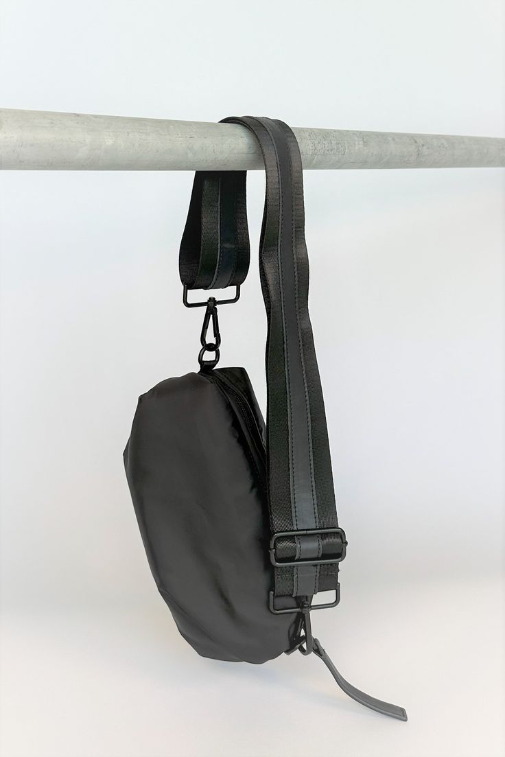 black nylon belt bag with black crossbody strap with black leather detail Black Crossbody Bag Strap With Removable Pouch, Functional Black Nylon Shoulder Bag, Casual Black Chest Bag With Detachable Strap, Black Bag With Detachable Strap For Outdoor, Black Crossbody Bag Strap For Everyday Use, Black Leather Bag Strap For On-the-go, Functional Black Shoulder Bag With Gunmetal Hardware, Sporty Everyday Shoulder Bag With Adjustable Straps, Black Travel Chest Bag With Detachable Strap