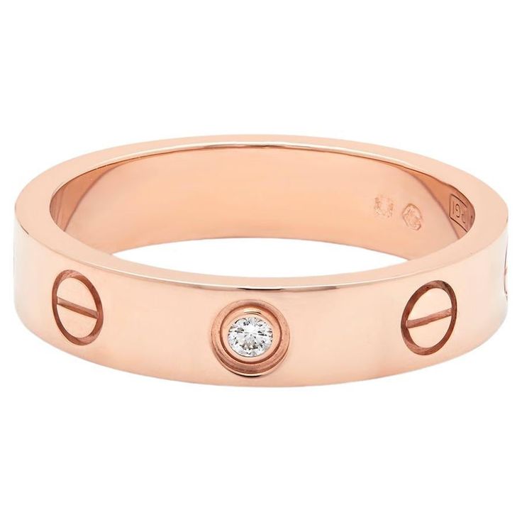 Cartier rose gold Diamond Love ring. This iconic Love ring set with a single diamond representing your Love in one beautiful ring. This ring is set in rose gold with 1 single diamond, 0.02ct. Signed Cartier Purchased in Jan 2024 Stamped 750 Model Number: B40507 Ring size: 50, US: 5.5 UK: K and a half Width: 4mm Comes complete with Cartier Box and Cartier Certificate  Cartier RRP: £2270 Luminary Fine Jewellery price: £1870 Cartier Rose Gold, Gold Love Ring, Cartier Diamond, Cartier Love, Beautiful Ring, Gold Diamond Rings, Rose Gold Diamonds, Love Ring, Pricing Jewelry