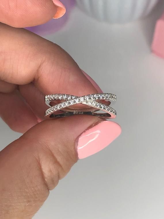 ***The ring is on Promotional Sale at 50% Off. Regular price for this ring is $33-$42***It is Beautiful Solid Sterling Silver 925 Criss Cross Ring With CZ Diamonds *** It will not rust or turn your finger green ***Will come in a box (one per package). Let us know if you have specific request please!:)💵 Follow Our Instagram for discounts and promotions @cupoftea925**We just opened our Store here on Etsy and very Exited to introduce you to our Sterling Silver 925 Jewelry:) (All Solid Sterling Sil Cris Cross Diamond Ring, Cubic Zirconia Stackable Rings With Round Cut, Stackable Cubic Zirconia Rings Round, Stackable Moissanite Rings For Promise, Stackable Moissanite Promise Ring, Silver Moissanite Crystal Ring With Ethical Diamonds, Moissanite Stackable Diamond Ring In Fine Jewelry Style, Moissanite Stackable Rings Fine Jewelry, Cubic Zirconia Open Band Stackable Rings