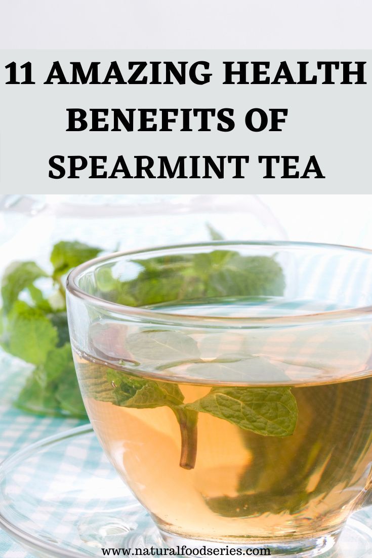 a cup of green tea with mint leaves in it and the words 11 amazing health benefits of spearmint tea