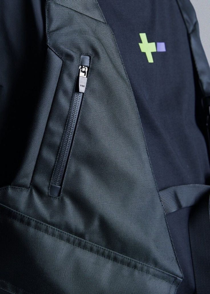 a backpack with a cross on the front pocket