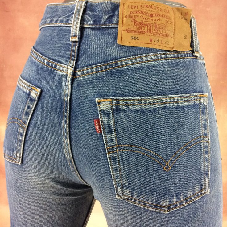 "Size 28 Vintage Levi's 501 Jeans - W28 L33 - Button Fly Jeans - 90' Jeans Slim Fit Tapered Leg - Red Tab - Made in USA, waist 28\" Medium Brand: LEVIS 501 Size On Tag marked W29 L32 but fits more like 28\" waist, 11.75\" rise, 23.5\" thighs, 42\" hips, 33\" inseam, 14.5\" leg opening! Fits a size 28, but check your measurements and compare the measurement with your garment. (see full measurement below) Recommended waist size: 28\" (28x33) *size 28 for a waist of 28 inches, expect your jeans to measure about 14\" across at the waist (Doubled 28\") to fit. Please follow our measurement guide: https://www.instagram.com/p/B2o273Kl5Oi/?igshid=1q5azikfj59p4 Material :  Cotton 100% Made In USA Measurements:- All measurements are taken with the garment laying flat, doubled for the Waist, hip &, e Vintage Fitted Jeans With Button Closure, Vintage Mid-rise Jeans With Buttons, Red Fitted Vintage Jeans, Fitted Vintage Red Jeans, Levis 501 Women, Levi 501 Jeans, Levi Jeans Women, Levis 501 Jeans, Levis Vintage