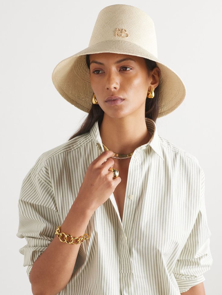 The elongated crown on Ruslan Baginskiy's bucket hat instantly sets it apart from other styles. Hand-woven from natural straw, it has a wide brim and the designer's initials decorating the front. Bucket Hat Outfit, Straw Bucket Hat, Safari Hat, Flat Dress Shoes, Gucci Eyewear, Dress Flats, Outfits With Hats, Ski Wear, Everyday Wardrobe