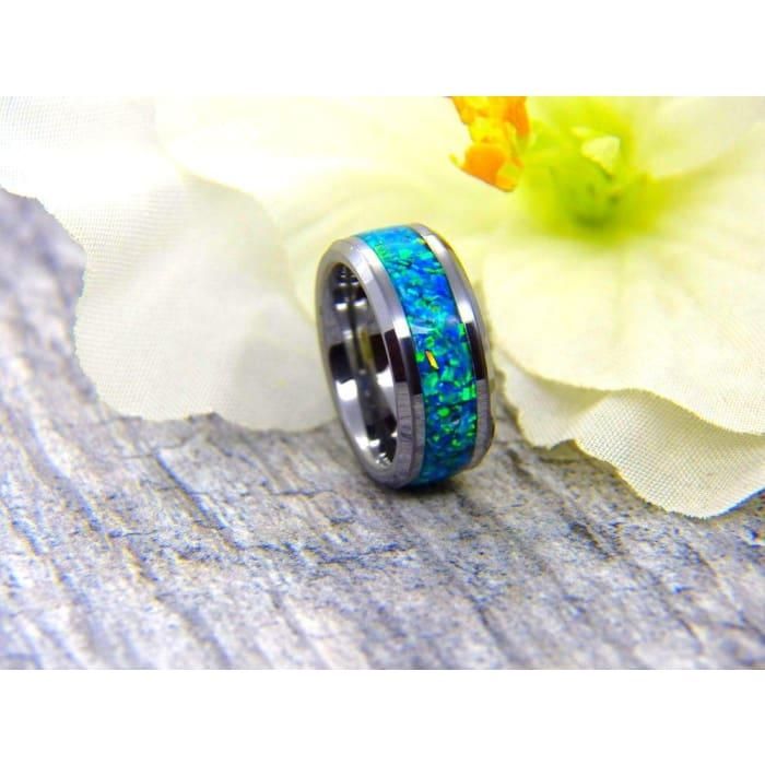 Bring a little fun to your everyday accessories with the addition of this stylish everyone ring. Get it set with a peacock blue inlay for a sophisticated look. Mark the occasion of an engagement with this elegant and refined gift. comes in 6mm standard women’s width or 8mm standard men's width to ensure your ring is comfortable but won't slip off. This ring is custom-made to truly reflect your unique style. Available in a gorgeous black ceramic ring core for scratch resistance. This stylish peac Modern Blue Jewelry For Promise, Classic Blue Stainless Steel Jewelry, Elegant Titanium Ring Jewelry, Elegant Titanium Ring, Classic Blue Opal Ring Gift, Classic Blue Opal Ring For Gift, Classic Blue Opal Ring As Gift, Classic Blue Opal Ring As A Gift, Classic Titanium Jewelry For Gifts