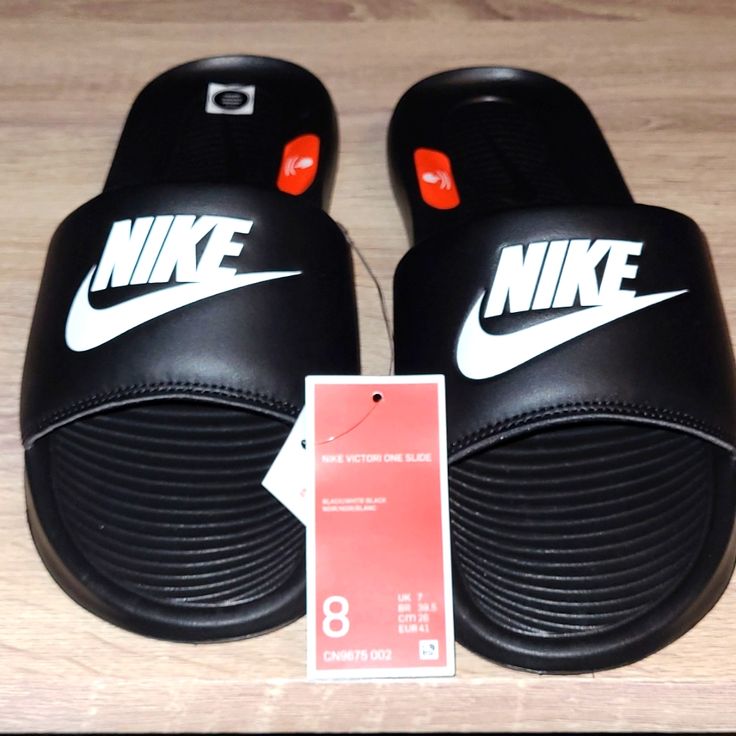 Nike Unisex Slides With Enhanced Comfort Black Nike Sneakers With Logo Print, Black Slides For Leisure In Spring, Black Non-slip Slides For Leisure, Nike Casual Slides For Streetwear, Nike Casual Training Slides, Black Slides For Streetwear In Spring, Black Slides For Spring Streetwear, Black Slip-on Sneakers For Leisure, Black Sporty Non-slip Slides