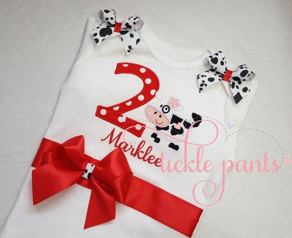 --♥♥-- Your birthday top will be embroidered with your girl's birthday number in red fabric (fabric print will vary). Sided next to the number will be a cute little cow. Your sweet pea's name will be either above or below the design, wherever it fits best. Matching bows will be sewn to each shoulder. SIZING:Bodysuits are Carter's brand and smaller and are available in sizes 3m, 6m, 9m, 12m, 18m, 24m.Shirts are specific for embroidery and run true to size. Available sizes 2T, 3T, 4T, 5, 6 and 8. Fitted Red Top For Birthday, Red Fitted Top For Birthday, Cute Red Top For First Birthday, Cute Red Tops For First Birthday, Red Cotton Top For First Birthday, Cute Red Top For Birthday, 1st Birthday Shirt, 1st Birthday Shirts, Cow Farm