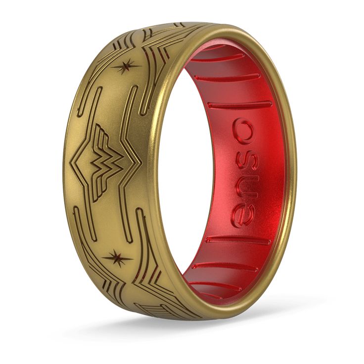 Embrace the empowering spirit of Wonder Woman™ with the Tiara Ring. Featuring an antique gold and ruby DualTone design, this silicone ring is intricately etched with a pattern of Wonder Woman’s iconic emblem and crown. Let it adorn your hand as a symbol of your own inner strength and grace, inspired by the legendary warrior princess. Lifetime Warranty: Every Enso ring comes with a lifetime guarantee. If your ring breaks, stretches out, or fades, we’ll replace it for the lifetime of the buyer. Made in the Rockies: Made with the highest quality materials to set the standard for luxury silicone rings Ultra Comfortable: Unique, flexible design for ultra comfort even with swelling fingers and hands Safe: Engineered with Anti Ring Avulsion Technology to break away and protect your finger Breatha Enso Ring, Enso Rings, Dc Comics Collection, Tiara Ring, Silicone Ring, Silicone Rings, Warrior Princess, Flexible Design, Inner Strength