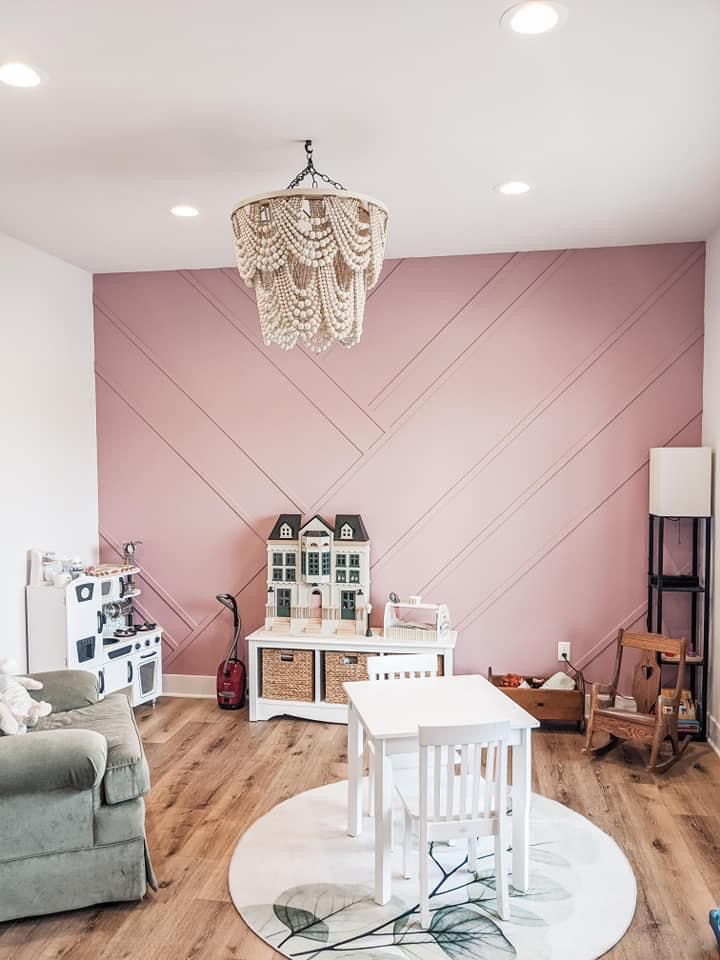 a living room filled with furniture and a chandelier