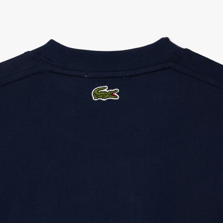 Lacoste Signature Print Cotton T-shirt Navy Blue TH2733 166 A Lacoste wardrobe essential, designed to move with you. This heavy jersey T-shirt features iconic branding and pleat details. A warm, comfortable design with an impeccable finish. A versatile piece made for modern life.This unisex product runs large, if you are a woman, choose 1 size smaller than your usual size. Heavy cotton jersey Comfortable cut, dropped shoulders Timeless crew neck Contrast print on breast Embroidered crocodile on Paris T Shirt, Comfortable Design, Signature Print, Modern Life, Product Label, Trending Now, Jersey T Shirt, Cotton T Shirt, Heavy Cotton