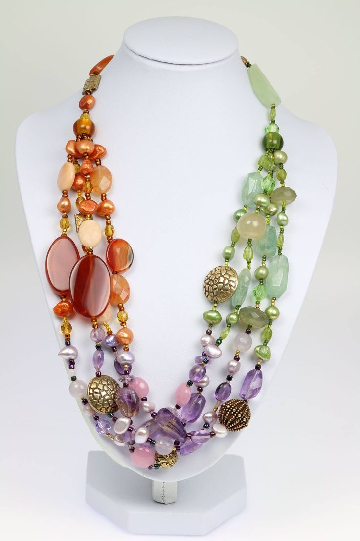 Fasten the Prehnite Amethyst Carnelian Necklace around your neck and voila!--instant color! The trio of complementary hues in this handmade necklace will brighten up whatever you pair it with and makes the piece fashionable for wear in every season. Use this multi-strand beaded gemstone necklace to give a little black dress a colorful finish, or match its colors to a blouse, sweater or dress for a stunning day or night look. The necklace includes smooth amethyst, carnelian and prehnite gemstones Amethyst Beaded Necklace, Amethyst Jewelry Necklace, Statement Jewelry Necklace, Extraordinary Jewelry, Multi Strand Beaded Necklace, Carnelian Necklace, Long Beaded Necklace, Amber Beads, Handcrafted Necklace