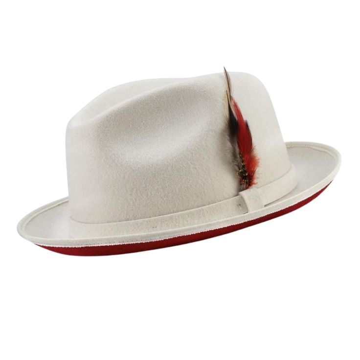 Step into a bygone era of style with the Vintage Vogue Collection's Montique White Wool Felt Dress Hat, featuring a dramatic red bottom. This handsome two-tone hat combines old-world charm with modern flair, making it a standout accessory for any gentleman's wardrobe. Crafted from high-quality wool felt and adorned with a tasteful felt band, this hat not only looks good but feels great without lining, ensuring lightweight comfort throughout the day.  The 2 ¼" brim offers both sun protection and Vogue Collection, Felt Dress, Gentleman's Wardrobe, Hat Size Chart, Red Bottom, Derby Day, Dress Hat, Hat For Men, Bygone Era