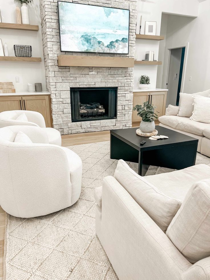 the living room is clean and ready to be used as a family room with white furniture