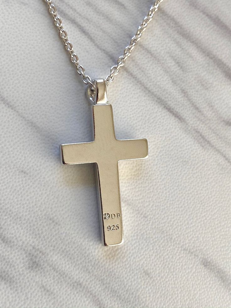 "This classic design adds a modern touch with the elevated smaller internal cross. Premium Sterling Silver Chain Included: Includes our signature sterling silver 925 chain that is offered in 16\", 18\", 20\", or 24\". Pendant Length: 25 mm Pendant Width: 16 mm Free Shipping & Returns Available on All Orders Materials & Crafting: We are known for our quality. Divine Box pendants and chains are beautifully crafted using sterling silver - the highest quality and purity of silver used for je Cross Pendant Necklace With Cable Chain As Gift, Gift Cross Necklace With Cable Chain, Sterling Silver Cross Necklace With Pendant, Sterling Silver Cross Pendant Necklace With Polished Finish, Sterling Silver Necklace With Cross Pendant And Polished Finish, Sterling Silver Crucifix Necklace With Polished Finish, Hallmarked Sterling Silver Cross Necklace, Classic Sterling Silver Pendant Cross Necklace, Classic Polished Crucifix Cross Necklace