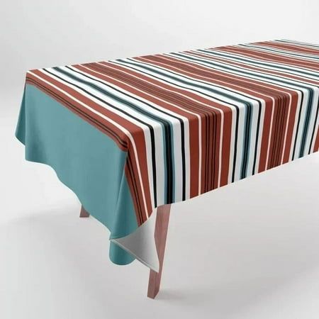 a striped table cloth on top of a wooden table