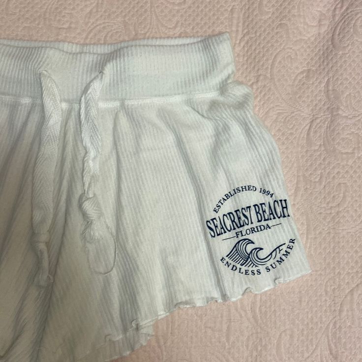 Size M - Never Worn White Flowy Shorts Cauliflower Hem Navy Logo “Seacrest Beach, Florida - Established 1994 - Endless Summer” Drawstring Tie Perfect As Day Shorts, Sleep Shorts, Or A Coverup! Bottoms With Built-in Shorts For Beach Party, Casual Stretch Beach Shorts, Casual Stretch Shorts For Beach, Beach Season Stretchy Beachy Shorts, Stretch Beachy Shorts For Beach Season, Short Bottoms For Beach Party, Beachy Stretch Shorts For Beach Season, Beachy Cotton Pajama Shorts For Summer, Stretch Shorts For Beach Party