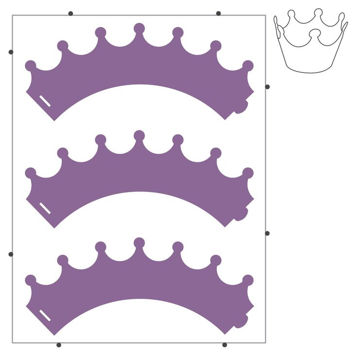 three crowns cut out to make the shape of a wall hanging on a white background