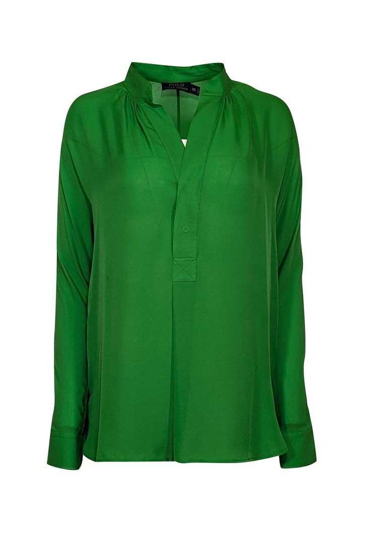 This top from Polo Ralph Lauren features long sleeves, a notch neckline, and a beautiful green color. Perfect for adding a touch of modern minimalist style to your office wardrobe, this top is both chic and timeless, with a classic design that exudes effortless elegance. This top will surely turn heads at the office! Size XS 100% Silk Fully unlined Notch neckline Minor pulls and runs throughout Long sleeves Pull-on style Bust 38" Waist 38" Shoulder to hem 28" Sleeve length 32.25" Elegant Green Tops For Workwear, Elegant Green Top For Workwear, Elegant Green Top For Work, Classic Green Blouse For Work, Classic Green V-neck Top, Classic Green Office Tops, Classic Green Office Blouse, Ralph Lauren Green Long Sleeve Tops, Ralph Lauren Green Tops For Spring