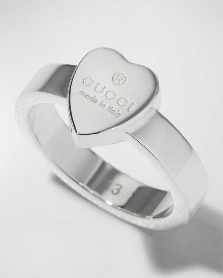 Gucci ring with engraved heart.    Sterling silver.    1/8" band width; 1/4" setting width; 3/8" setting height    Polished sterling silver hardware.    Clean and polish with a soft cloth, store separately.    Made in Italy. Trademark Symbol, Gucci Ring, Gucci Rings, Cloth Store, Silver Heart Ring, Gucci Jewelry, Silver Signet Ring, Heart Shaped Rings, Pave Ring