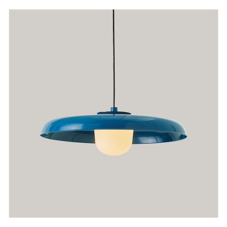 a blue light hanging from a ceiling fixture with a white light on the top and bottom