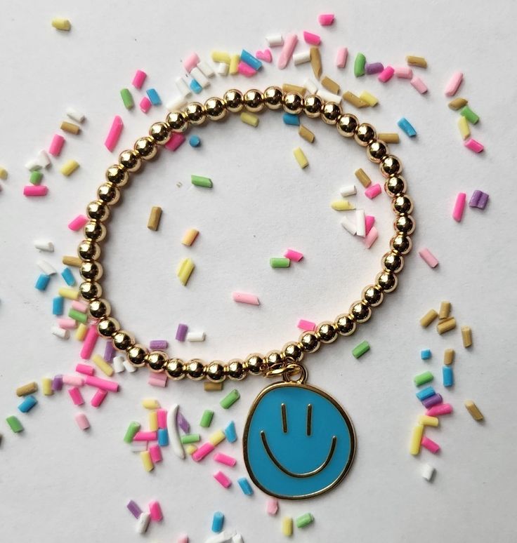 Smiley face charm bracelet. Cute Bracelets For Birthday Gift, Playful Nickel-free Charm Bracelet For Gift, Cute Gold Bracelets For Birthday Gift, Cute Blue Charm Bracelet For Gift, Fun Blue Bracelets For Gifts, Fun Blue Beaded Bracelets For Gifts, Personalized Fun Gold Bracelets, Cute Blue Stretch Bracelet For Birthday, Cute Blue Bracelet For Birthday