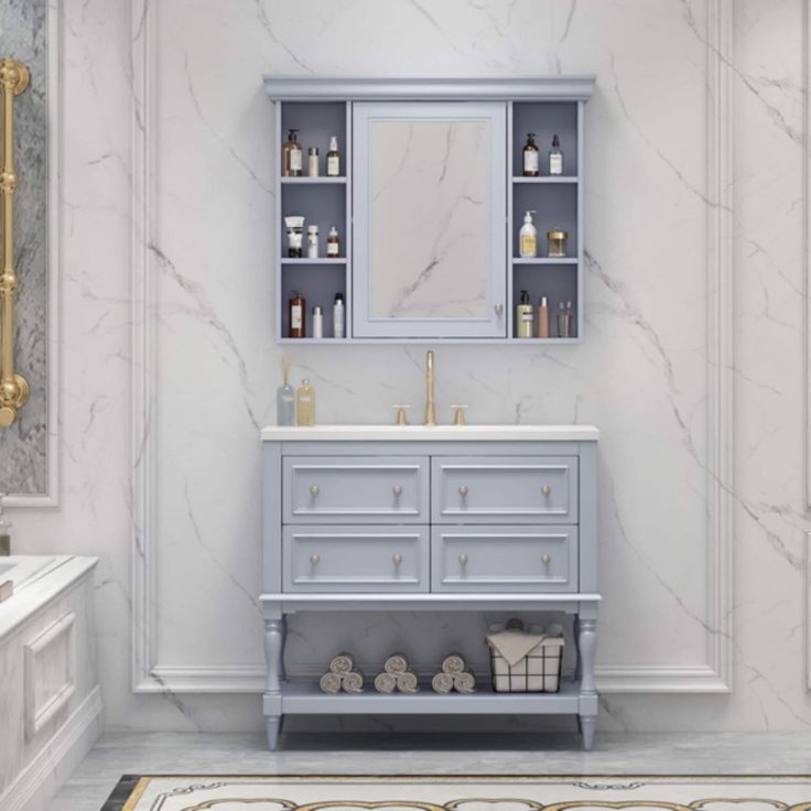 a bathroom with marble floors and white walls