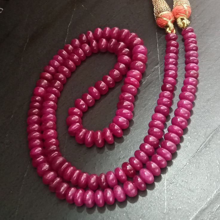 "Natural Ruby Necklace , 257.74 cttw , Ruby Mala , Ruby Beads Necklace , Ruby Necklace ,Ruby , African Ruby , Ruby Gemstone , Tanzanian Ruby Total Carat Weight : 257.74 Cts. Shape : Plain Round Flat Beads ( Drilled ) Strands : 1 Total Necklace Size : 21 Inches ( Adjustable ) Bead Size ( in mm ) : 5.5 - 7.5 x 3.5 - 5.0 Approx. ( Descending Size: biggest size in centre , smallest on ends ) Origin : Africa ( Tanzania ) A hand made \" Dori Type \" Closure Called \" Sarafa \" Made of silk threads , M Polished Double Strand Beads As Gift, Double Strand Polished Beads As Gift, Ruby Rondelle Beads For Jewelry Making, Elegant Gemstone Rondelle Beads, Elegant Rondelle Gemstone Beads, Traditional Double Strand Beads For Gift, Hand-strung Rondelle Necklaces For Gifts, Hand-strung Rondelle Necklace For Gift, Temple Jewelry With Polished Round Beads